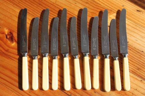 Six dinner knives and six side knives, marked Mexeur et Cie Sheffield